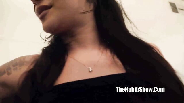 Hazel Marie closeup teasing lips necklace in black top