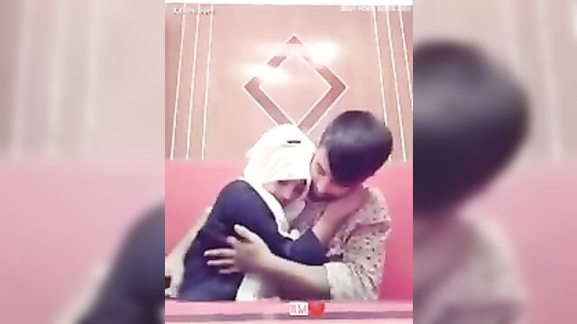Bangladeshi Muslim girlfriend hugged intimately by boyfriend in restaurant