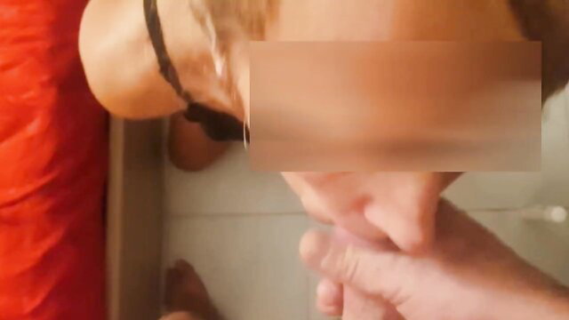 Amateur Asian woman in hat kneels for facial cumshot closeup