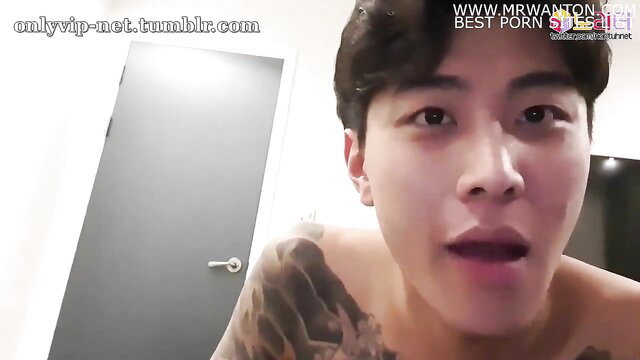 Hot Korean amateur guy shirtless with tattoos giving BJ closeup