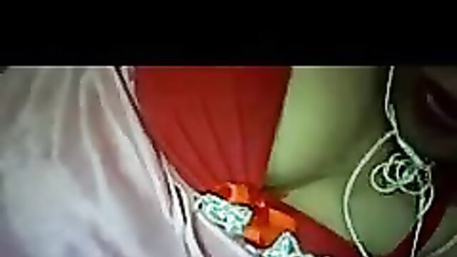 Big tits Asian beauty in red skirt and green top exposing cleavage