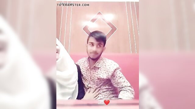 Bangladeshi couple hot smooch in restaurant, boyfriend hand on girlfriend