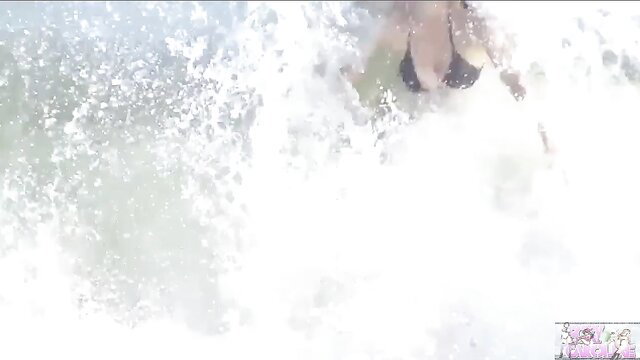 Foxy Caroline in hot swimsuit, wet splashing action