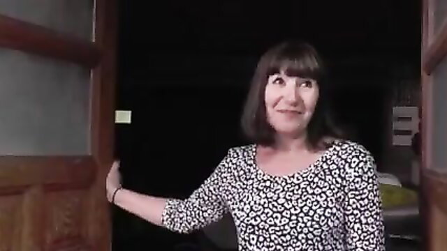 Horny French granny in leopard top smiling at door, craving sex