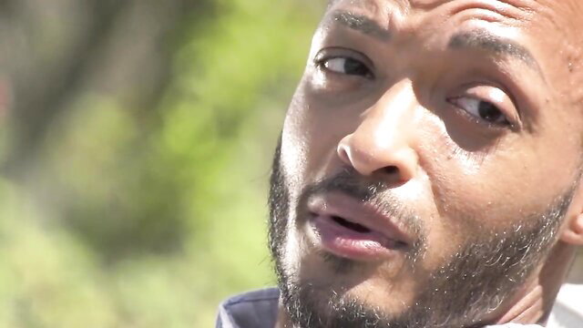 Febby Twigs' handsome black male model intense closeup gaze, oiled skin tease