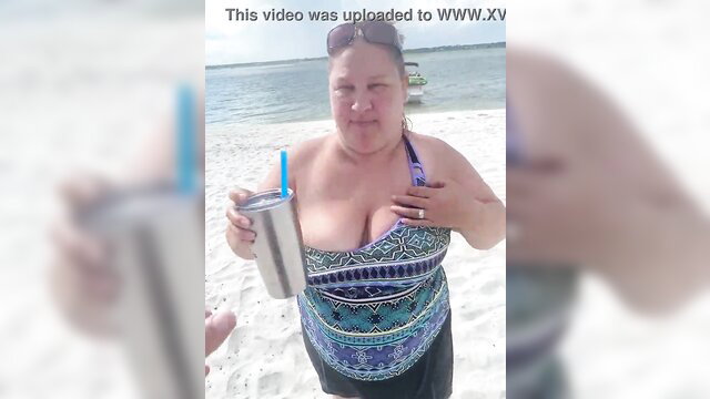 Slutty BBW duca wife flashes big tits on public beach