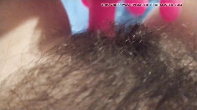 Extreme close-up of hairy pussy, wet and detailed view