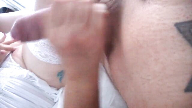 Amateur woman in lingerie fingers herself while handjobbing cock closeup