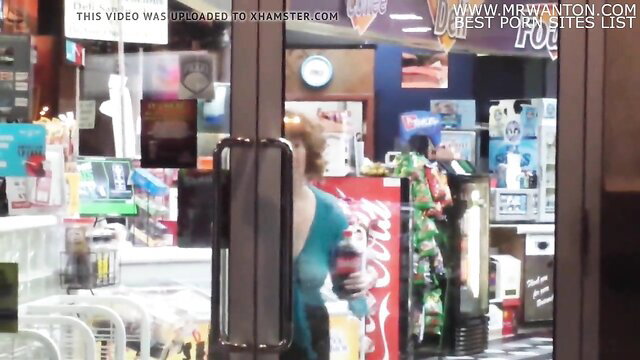 Blonde in see-through top flashes big tits at convenience store door