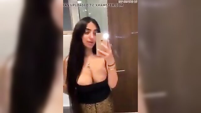 Arab beauty with massive cleavage in tight top and skirt mirror selfie