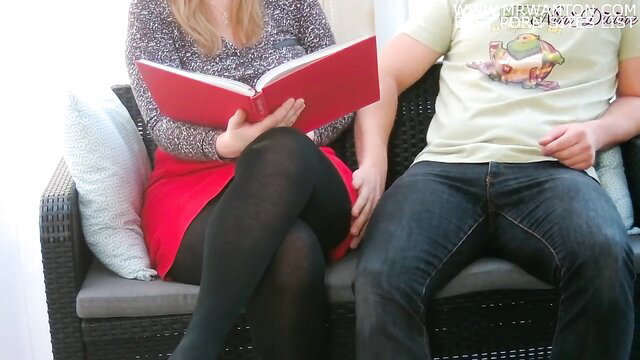 Blonde wife in stockings reads book on couch with husband, blowjob tease