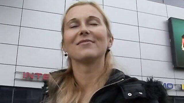 Mandy Paradise mature blonde smiling in leather jacket outdoors