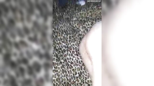 Blonde in leopard print dress on leopard print couch teases upskirt