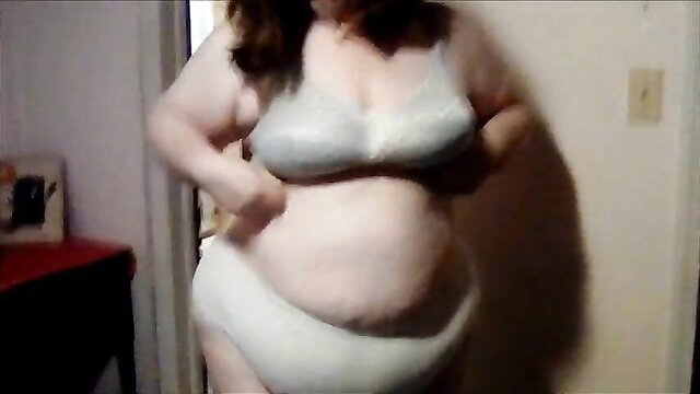Curvy redhead BBW bunny in gray bra and panties, changing clothes