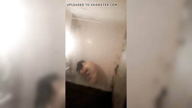 Steamy amateur voyeur video of busty mature mom showering unaware