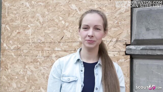 Cute teen Kinuski in denim shirt at German Scout casting