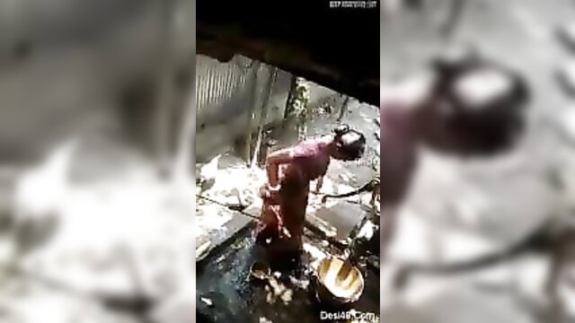 Desi Bhabhi bathing outdoors, wet saree clinging to curvy body