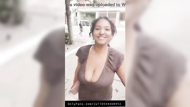 Juliettesweetz smiling in deep cleavage top on street, hot Latina tease