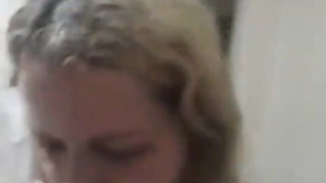Blonde woman close-up in amateur adult video making-of