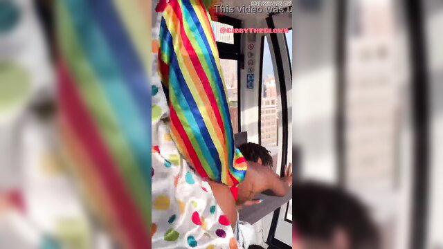 Gibby The Clown in colorful outfit at 2749 ft high, extreme height tease