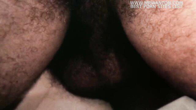 Closeup of hairy black man's heavy balls and thick cock in HD porn thumbnail