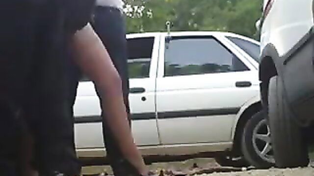Amateur dogging slut bent over white car outdoors flashing pussy