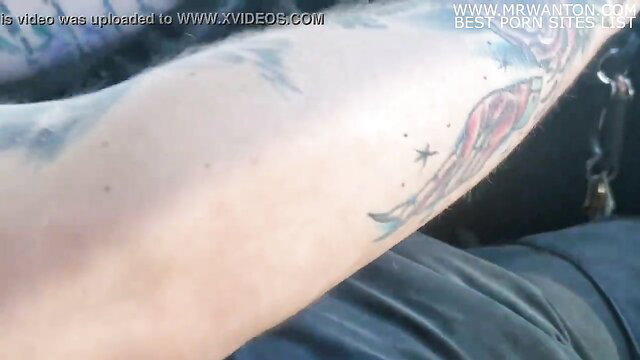 Tattooed guy teases dick with cum denial handjob while driving