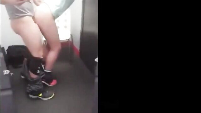 Slim Asian teen in gray shorts bends over in bathroom, hot ass upskirt view