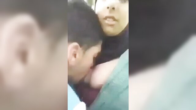 Arab guy passionately kissing woman's neck closeup