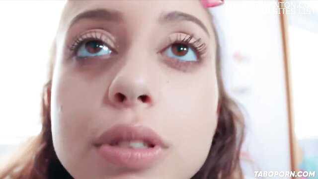 Closeup of cute mixed teen stepdaughter's face begging stepdad for iPhone