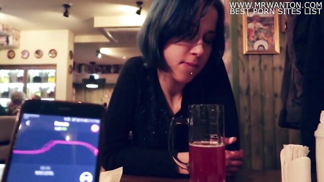 Blue-haired stepsis in bar holds beer as vibrator app on phone edges her to orgasm