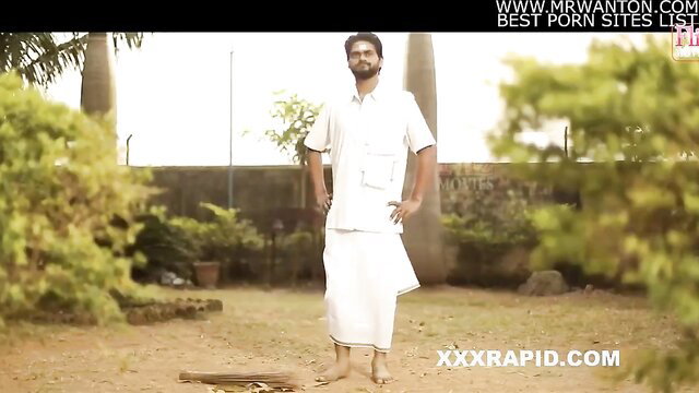 Indian man in white dhoti lungi stands in garden, hot desi tease