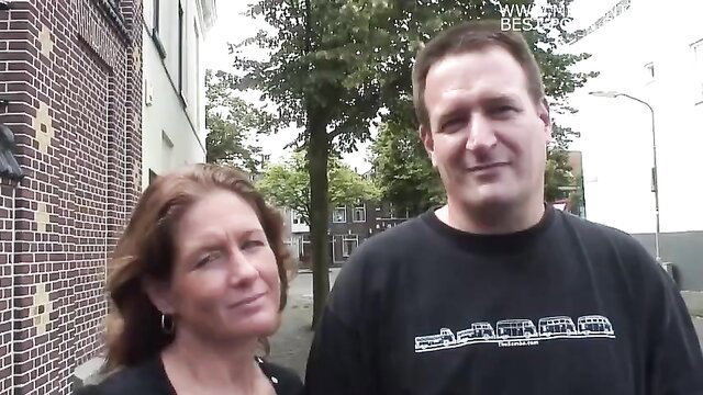 Dutch mature Manuela and man smiling outdoors on street