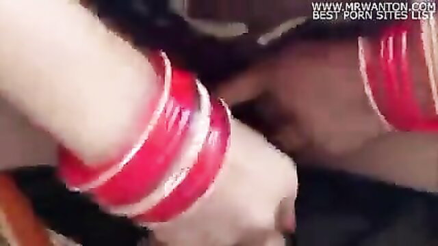 Desi wife hands with red chooda bangles in closeup tease