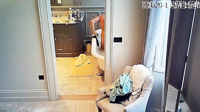 Milf bending over naked in bathroom, wet body on ipcam