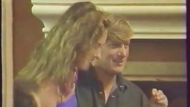 Gabriel Pontello with big-haired blonde in famille perverse 1993