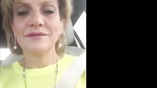 Closeup of smiling mature blonde granny with big natural boobs