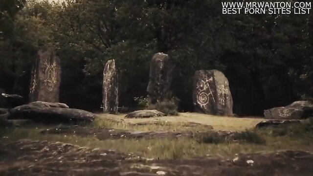 Pagan forest ritual with carved standing stones and lush greenery