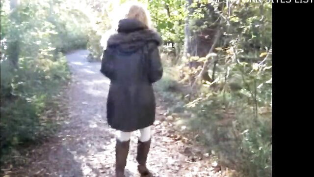 Mature blonde walks forest path in sexy coat, boots, stockings - 66 and Still Sizzling