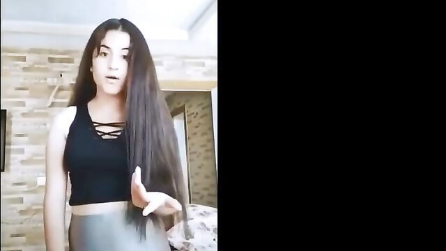 Arab teen in tight black crop top and grey leggings showing off curves