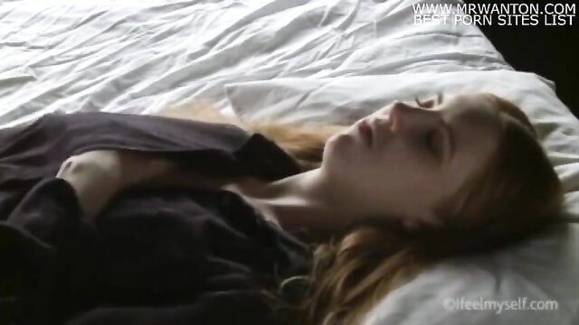 Cute redhead teen girl sleeping in bed, softcore tease