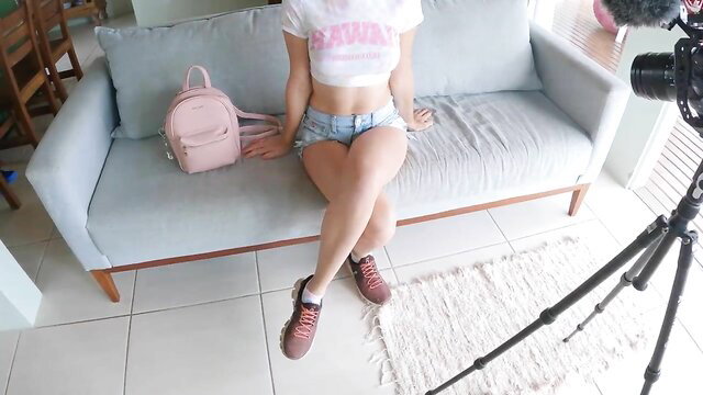 Amateur babe in crop top & denim shorts on sofa during casting