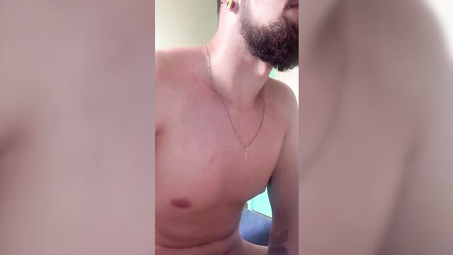 Bearded man neck up closeup, shirtless with chain necklace in amateur virtual sex thumbnail