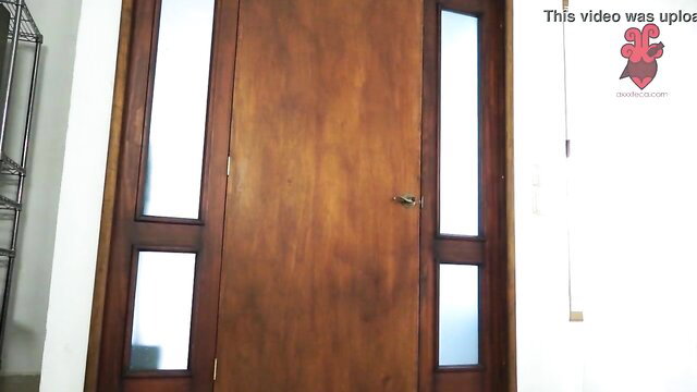 Amirah Adara at wooden door with frosted glass panels
