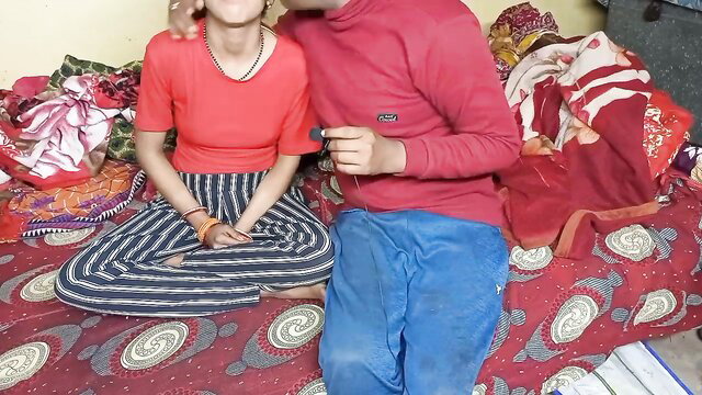 Indian brother-in-law hugs screaming sister-in-law on bed in red top
