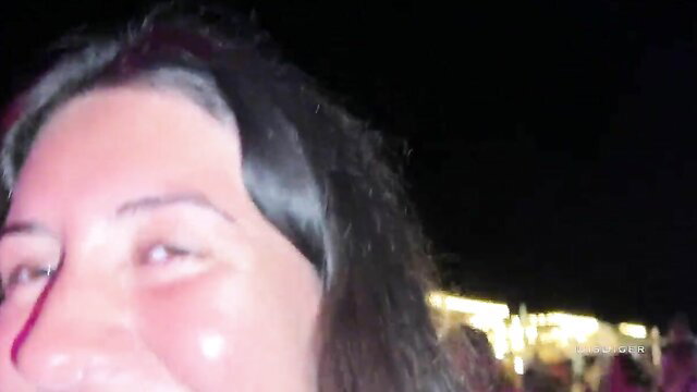 Smiling brunette wife flashes panties off in public night crowd