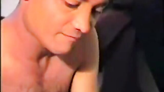 Closeup of Indian call girl's face and bare chest in steamy adult video