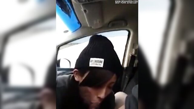 Asian girl in beanie hat gives blowjob in car, eager road head action