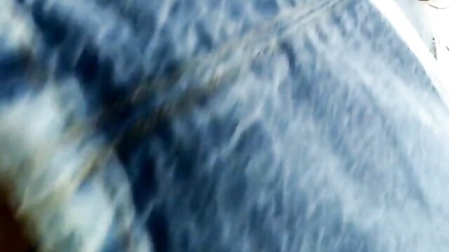 Blurry closeup of delicious big brunette ass in tight jeans