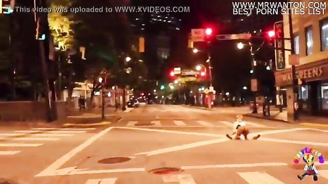 Clown dude gets blown by girl in middle of busy street at night